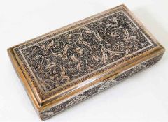A Persian silver cigar box decoratively presented with lions within chased decor