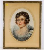 An oval mounted & framed portrait watercolour of a
