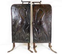 A pair of 19thC. copper Aesthetic Movement Arts & Crafts panel fire screens decorated with herons &