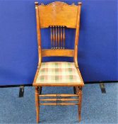 An Edwardian arts & crafts style chair with uphols