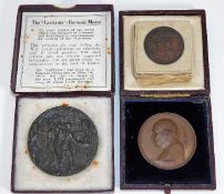 A bronze Lusitania medal with box twinned with a J