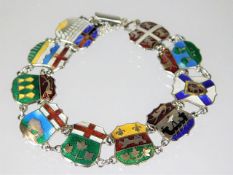 A silver & enamel flag novelty bracelet twinned wi