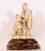 A well carved 19thC. Japanese ivory figure group o