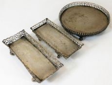 Three continental silver galleried trays, probably