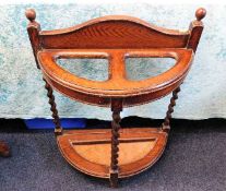 A 1920's oak stick stand with barley twist support