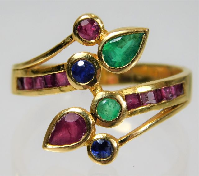 A yellow metal, tests as 18ct gold, ruby, sapphire