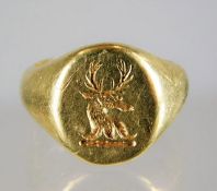 A heavy gauge circa 1890 18ct gold signet ring with reindeer crest 17.5g size N/O