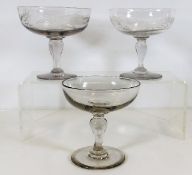 Three 19thC. champagne glasses, two with etched de