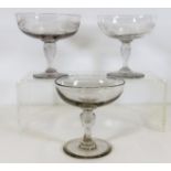 Three 19thC. champagne glasses, two with etched de