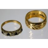 A 9ct gold band size L twinned with a sapphire & s