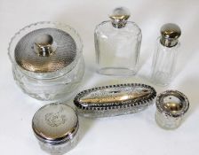 A silver topped flask twinned with five other silv