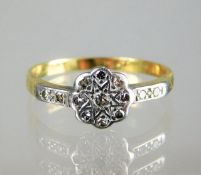 An 18ct gold ring set with platinum mounted diamon