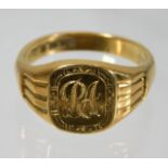 A heavy gauge 18ct gold ring with initials R A 10.