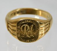 A heavy gauge 18ct gold ring with initials R A 10.