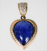 A 14ct gold pendant set with diamond & a sapphire