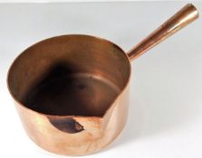 A French heavy gauge copper pan with decorative ha