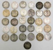 Thirty one silver three pence pieces dating from 1