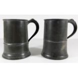 Two antique pewter quarts