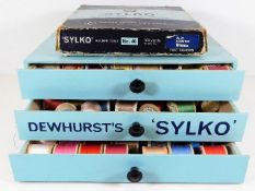 A Dewhurst's Sylko sewing box with contents twinne