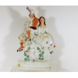 A Victorian Staffordshire clock figure group 14in