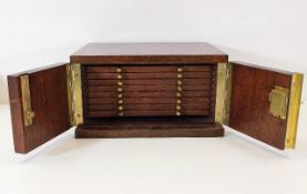 A good quality mahogany coin box with eight drawer