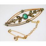 A 9ct gold brooch set with seed pearl & turquoise