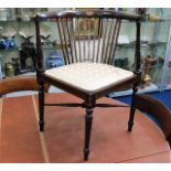 An antique Regency style corner chair with inlaid