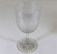 A Victorian wine glass with wheel cut foot & decor