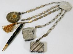 A silver plated chatelaine with two silver vestas