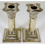 A pair of white metal corinthian column white meta