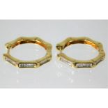 A pair of fine quality 18ct gold earrings set with