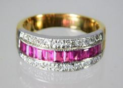 An 18ct gold ring set with 0.5ct diamond with a ru