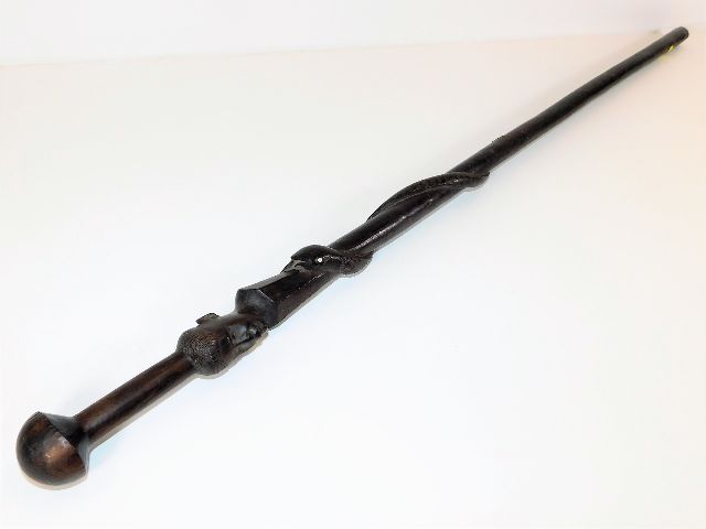 An African hardwood walking cane with carved snake