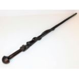 An African hardwood walking cane with carved snake