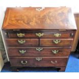 An 18thC. Georgian mahogany bureau with brass fitt