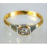 A small 18ct ring set with small diamond in white