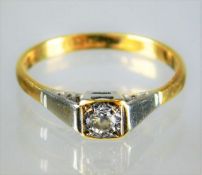 A small 18ct ring set with small diamond in white