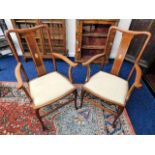 A pair of inlaid mahogany Edwardian carver chairs