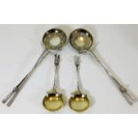 Four golf related silver plated spoons with gilt b
