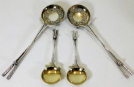 Four golf related silver plated spoons with gilt b
