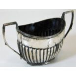 A silver sugar bowl with gadrooned sides London 18