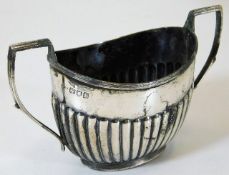 A silver sugar bowl with gadrooned sides London 18