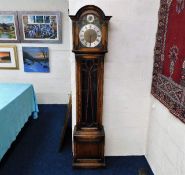A brass & silver coloured dial longcase clock with