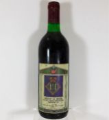 A bottle of red wine bearing the label Medical Mes