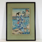 A framed 19thC. Japanese woodblock print by Toyoha