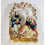 A 19thC. Staffordshire figure group, loss of feath