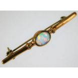 A yellow metal brooch with opal stone 2.2g