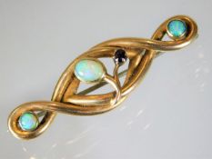 A 15ct gold brooch set with opal & garnet 4.8g