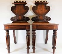 A pair of Victorian mahogany hall chairs, some losses