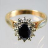 An 9ct gold diamond & sapphire ring 3.6g size L/M